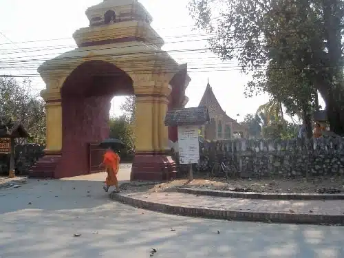 Temple and monk in Laos