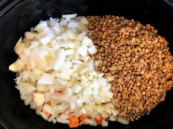 dried lentils and vegetables in a slow cooker