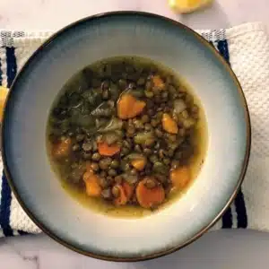 lentil soup with vegetables in a bowl.