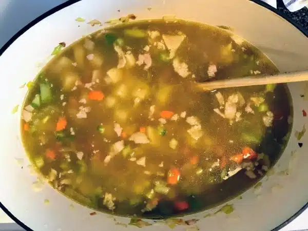Preparing the soup, broth added