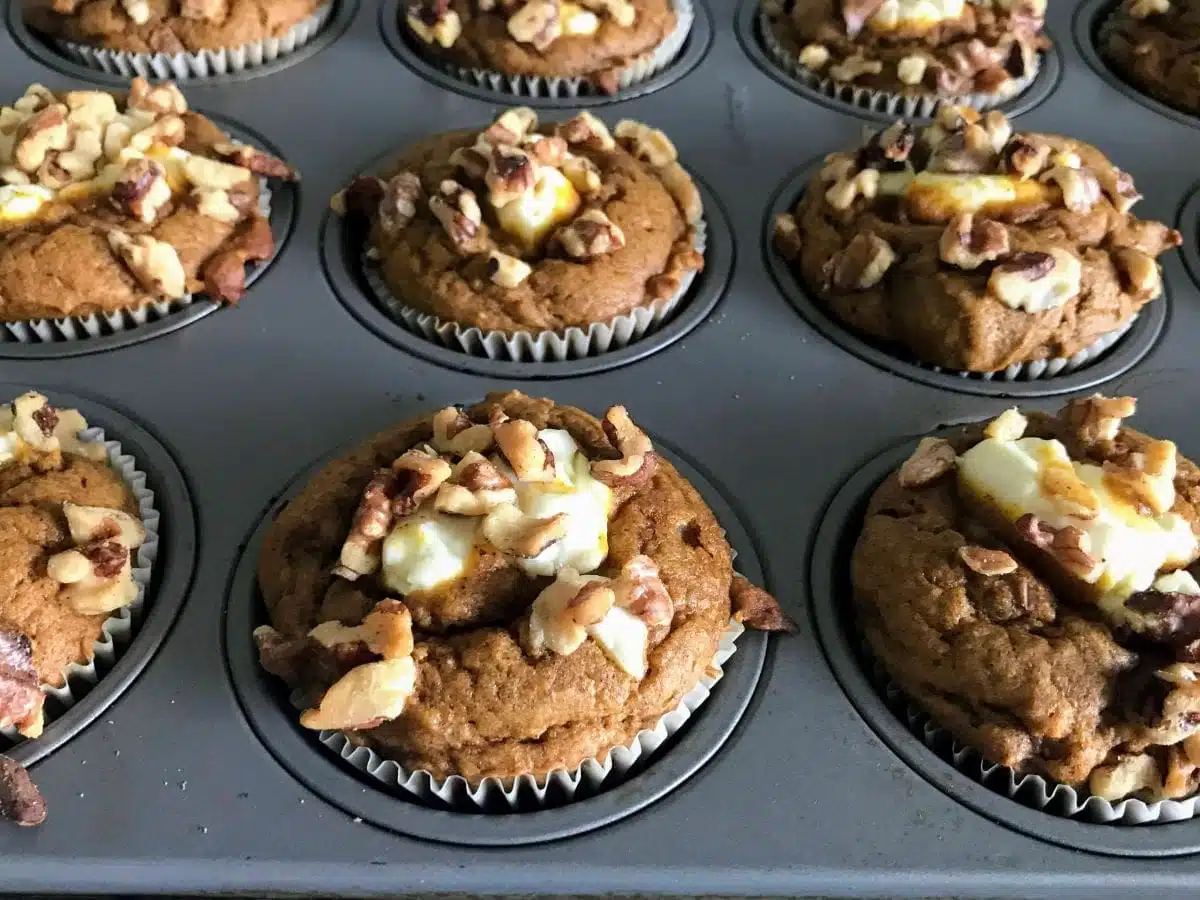 healthy pumpkin cream cheese muffins in muffin pan