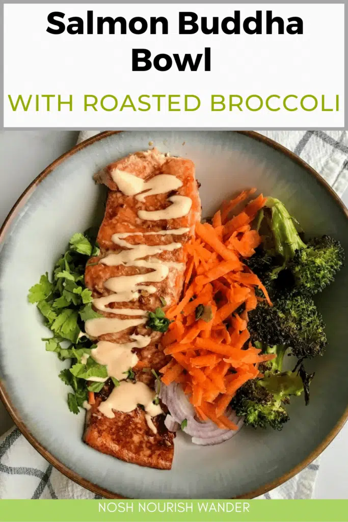 salmon buddha bowl with roasted broccoli and shredded carrots