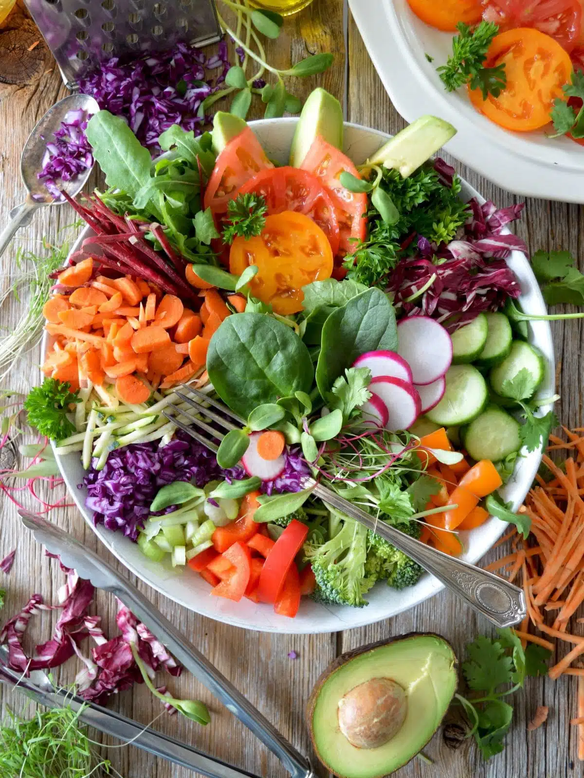 gut health 101, eating a large bowl of raw vegetables.