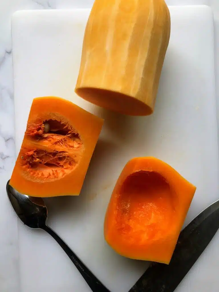 butternut squash sliced in half and seeds scooped out.