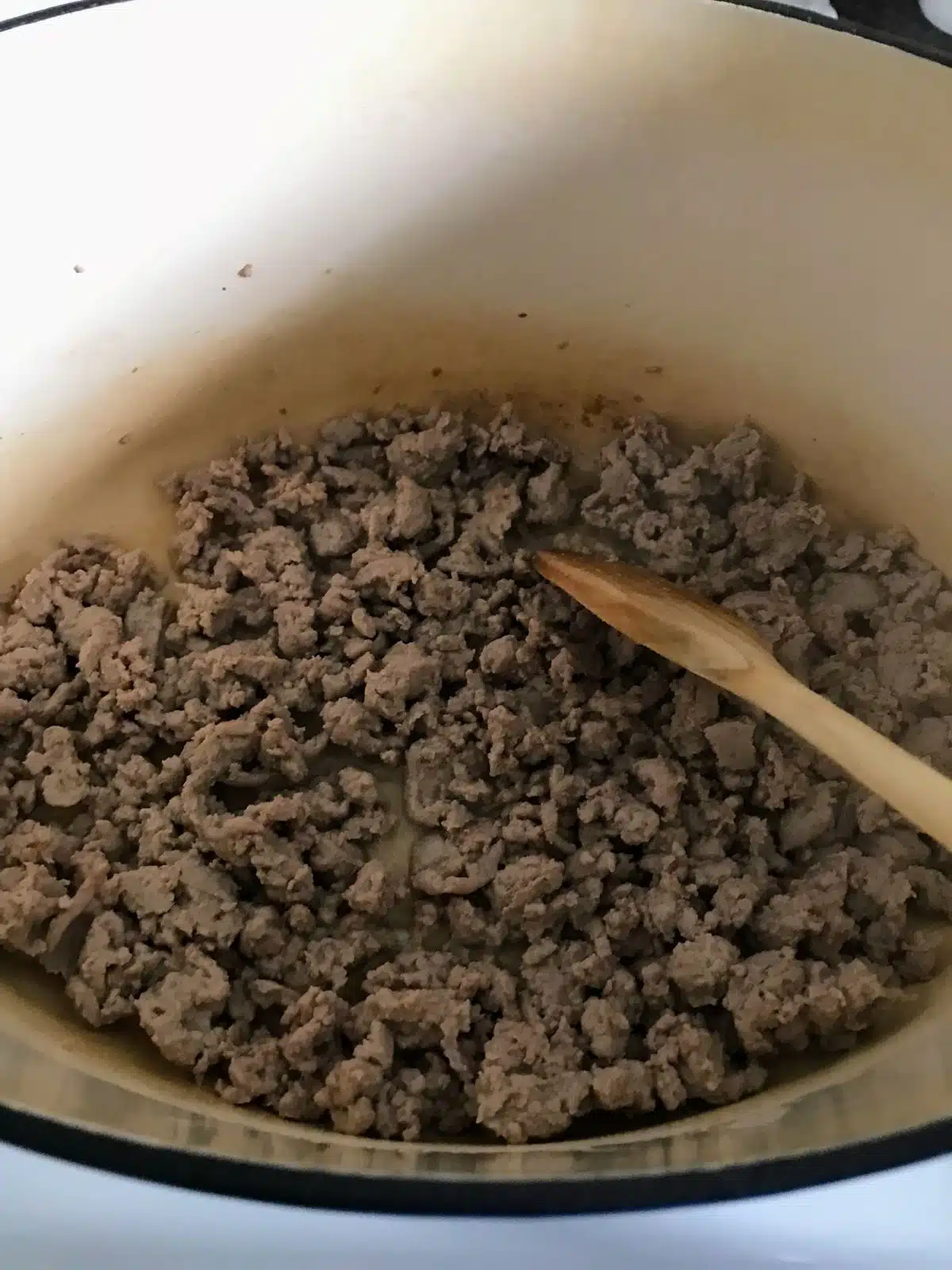Browning ground turkey in a Dutch oven.