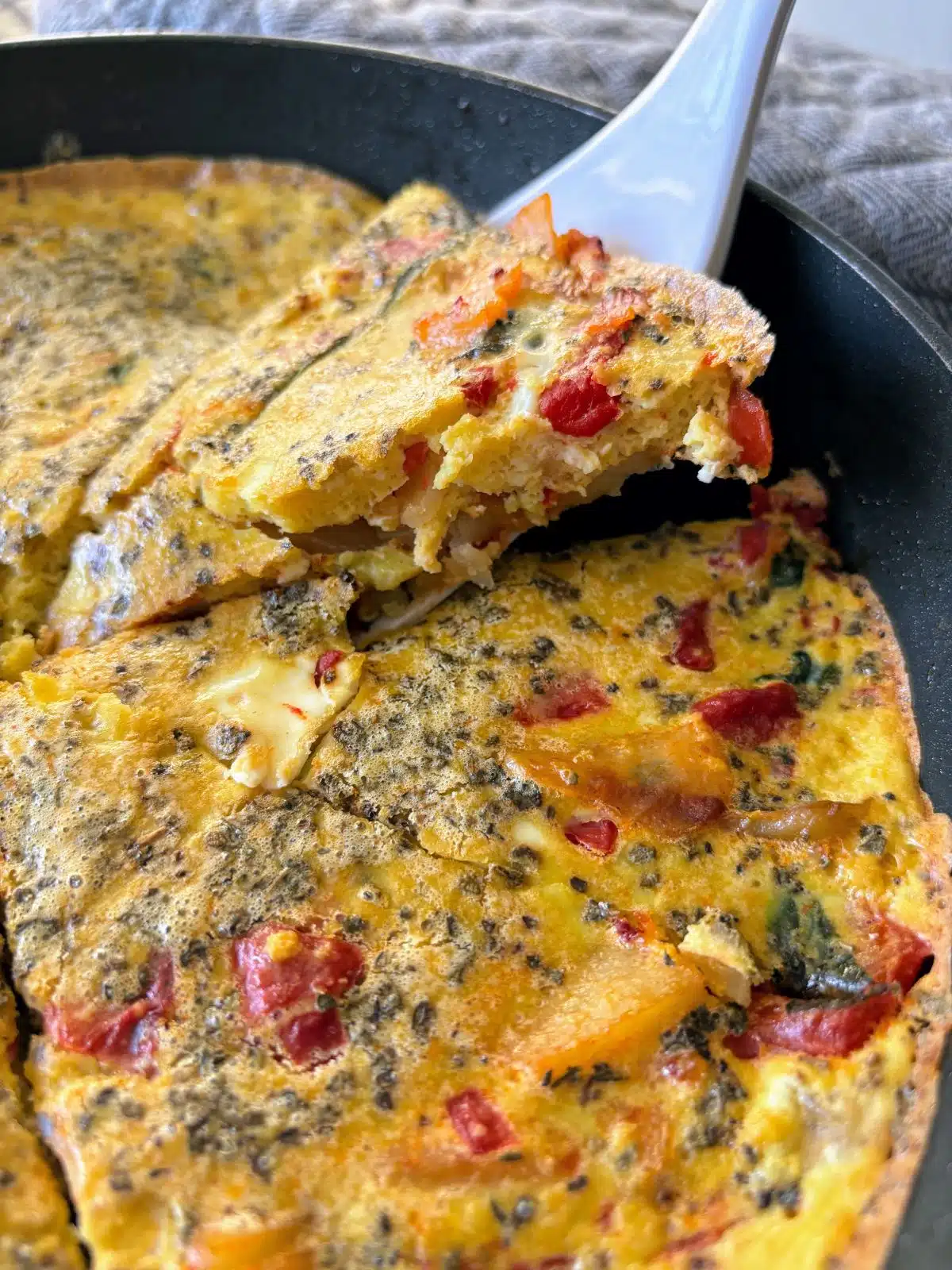 Dairy-free frittata with red bell peppers and potatoes.