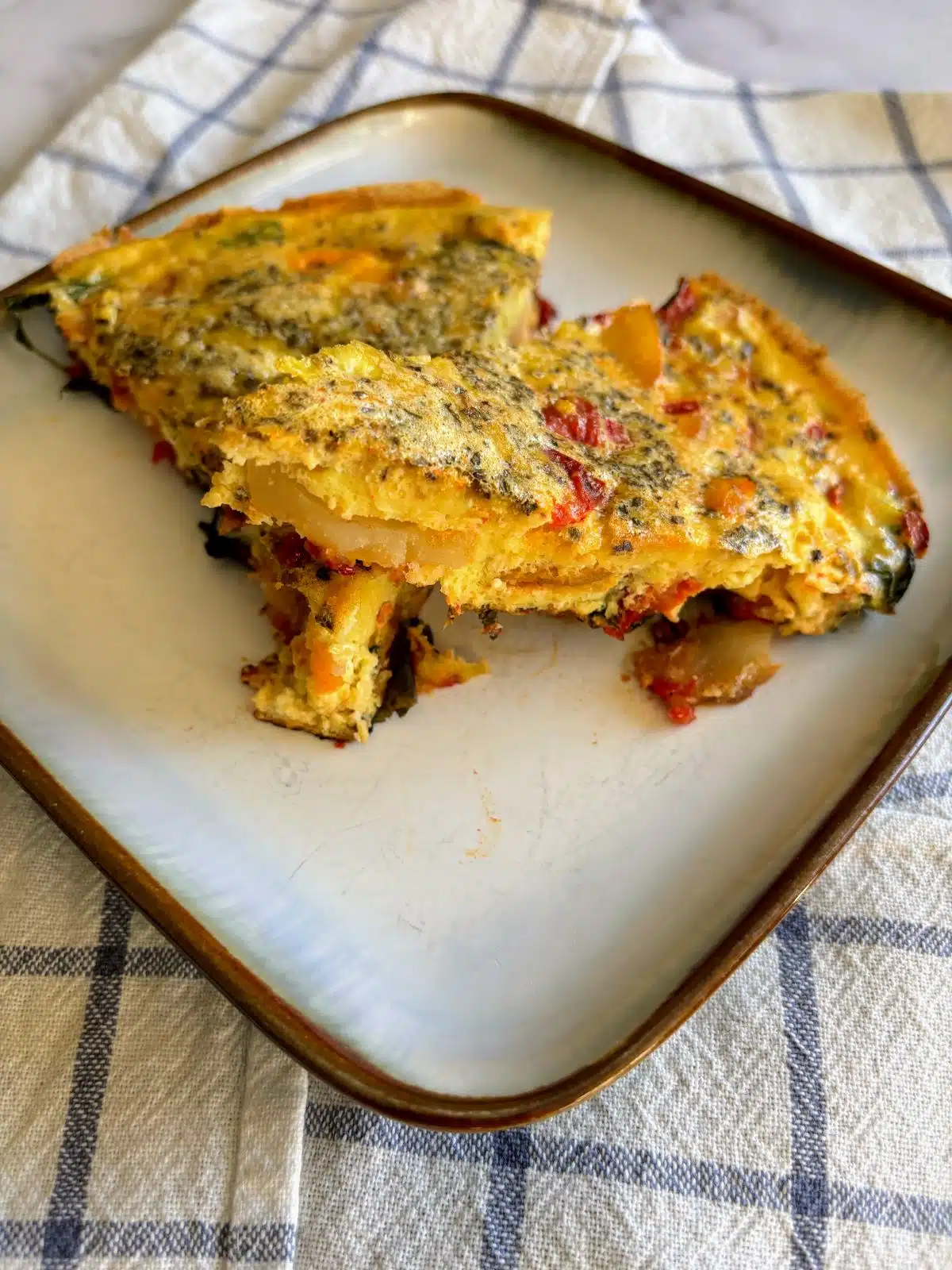 Slices of dairy-free frittata on a plate.