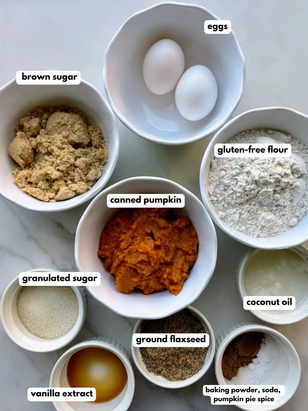 ingredients for low FODMAP pumpkin muffins in bowls and ramekins.