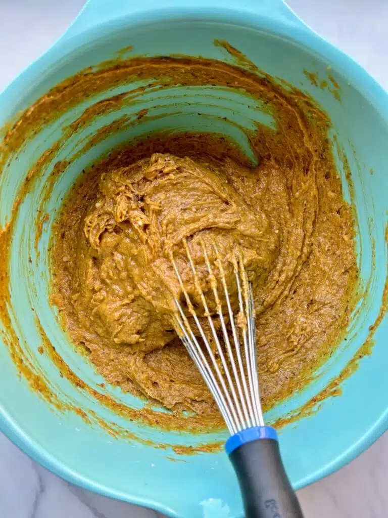 Dry ingredients added to wet ingredients and mixed with a whisk.