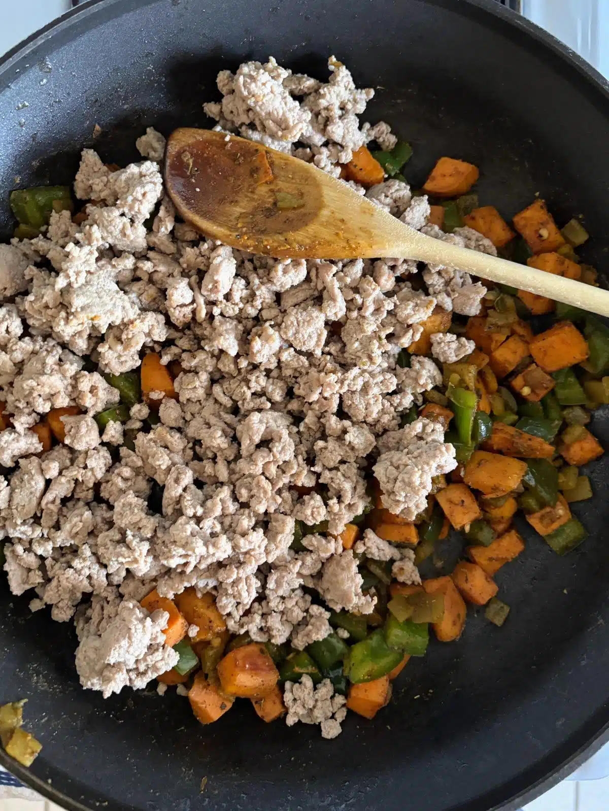 Cooking turkey, sweet potatoes, and bell peppers.