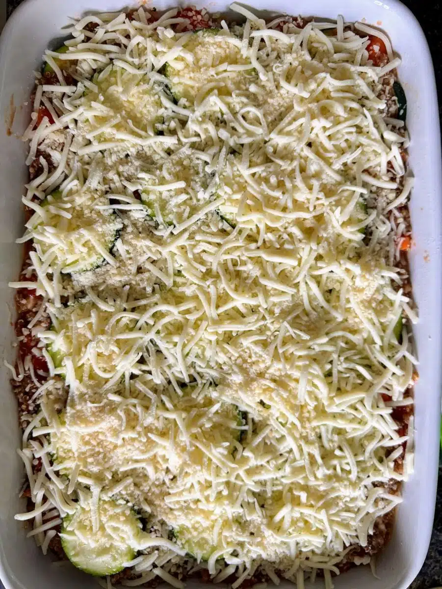 Shredded mozzarella cheese on top of casserole.